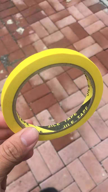 Cinta de pintor amarilla para superficies exteriores